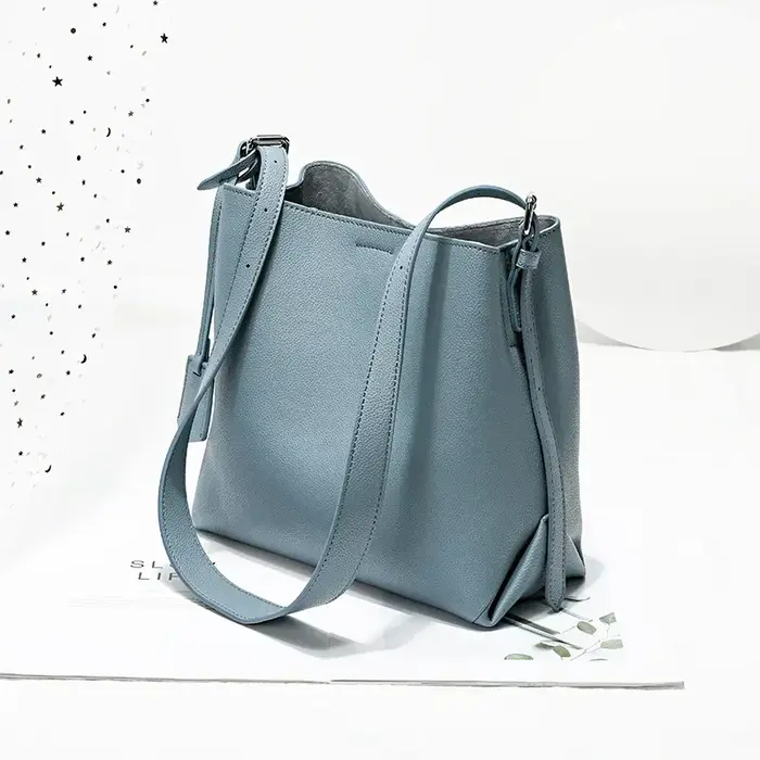 2025 Beige bleu couleur unie Design Simple sac seau en cuir de vachette femmes sac à bandoulière de haute qualité daim intérieur sac de messager