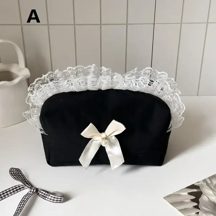 Trousse de maquillage noire en dentelle avec nœud
