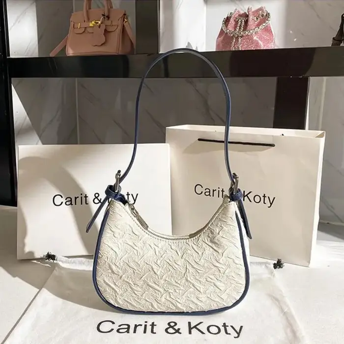 Sac plissé tendance de l'année, design original et raffiné, sac croissant pour femme, design de niche estival, sac porté épaule