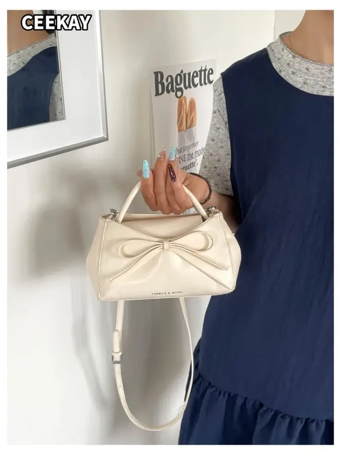 Sac à main mini trapèze élégant en PU souple avec grand nœud décoratif