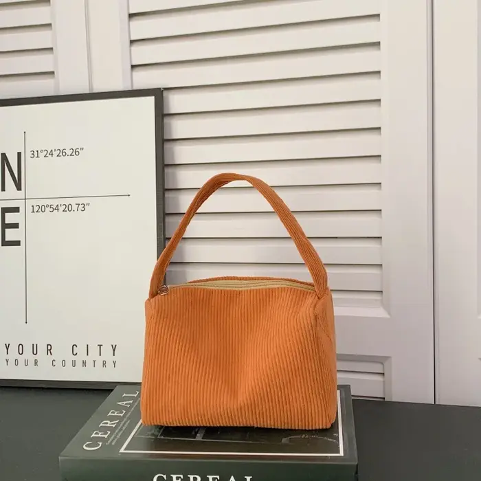 Sac carré compact à porter à la main