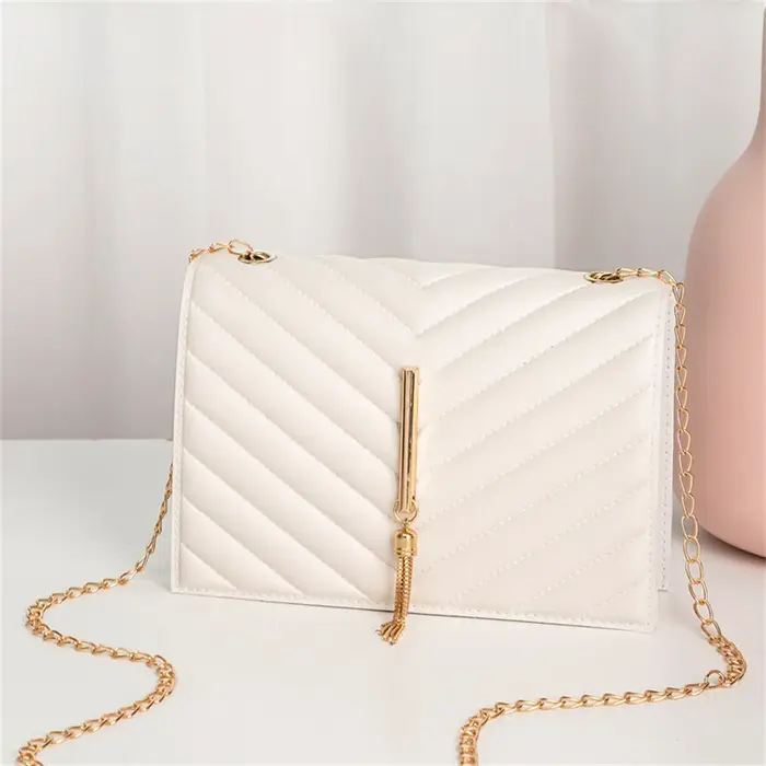 Mini sac à bandoulière à rabat avec pompon pour femme