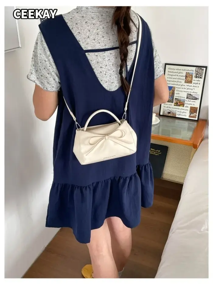 Sac à main mini trapèze élégant en PU souple avec grand nœud décoratif