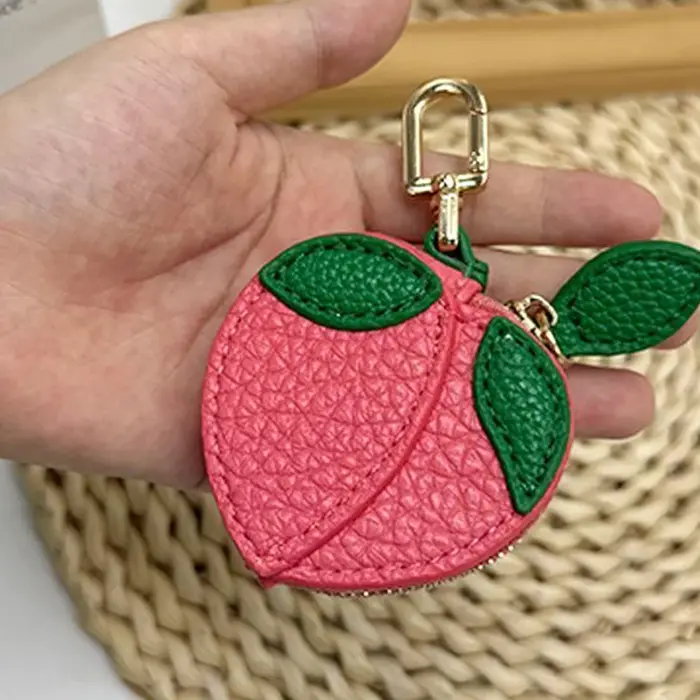1 pièce Porte-monnaie en cuir PU motif dessin animé, pochette en forme de fruit (pêche, pomme), breloque de sac multifonctionnelle pour clé de voiture et pièces de monnaie