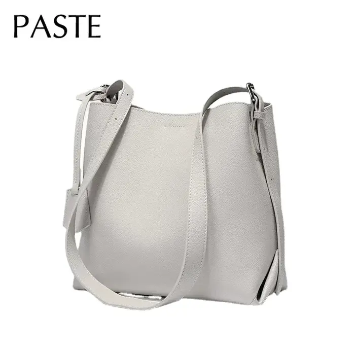 2025 Beige bleu couleur unie Design Simple sac seau en cuir de vachette femmes sac à bandoulière de haute qualité daim intérieur sac de messager