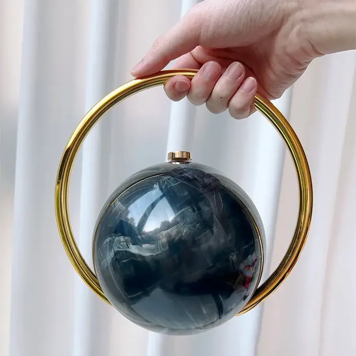 Pochette de soirée de luxe de styliste avec poignée en boule
