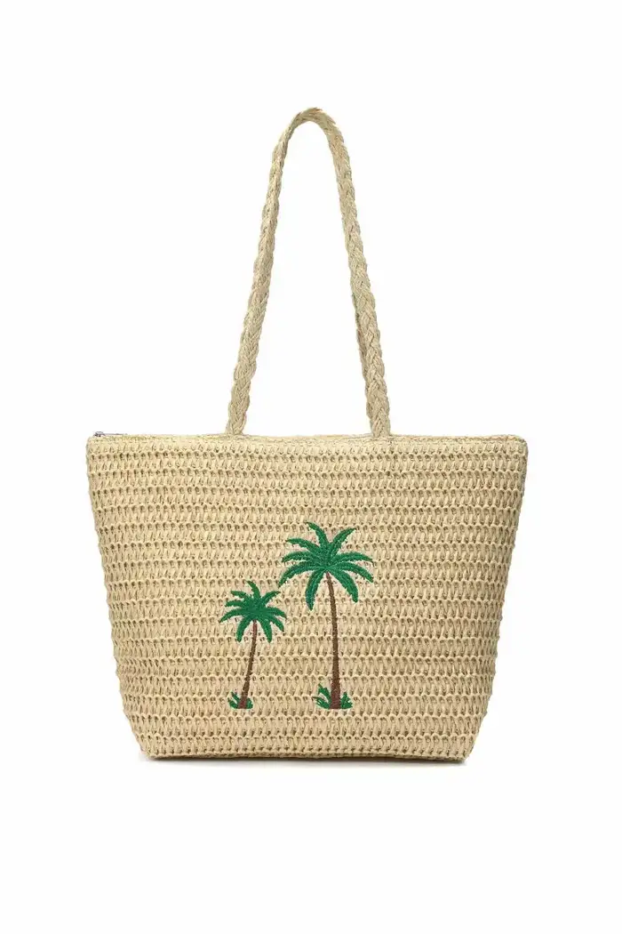 Sac à langer minimaliste de luxe : élégant sac à main bandoulière pour femme avec une touche de design vintage et un grand compartiment.