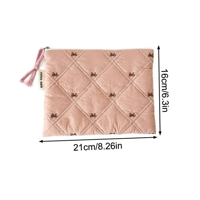 Pochette à cosmétiques matelassée avec nœud brodé