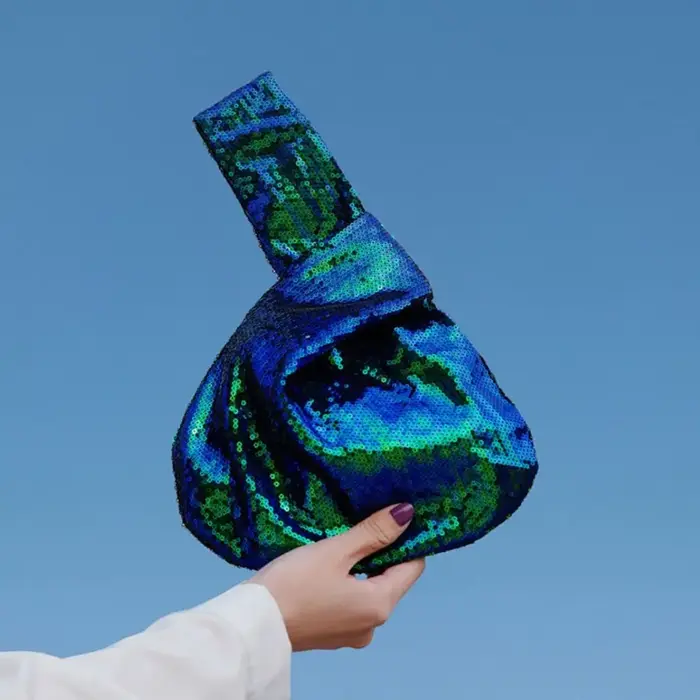 Sac à main portable à nœuds scintillants