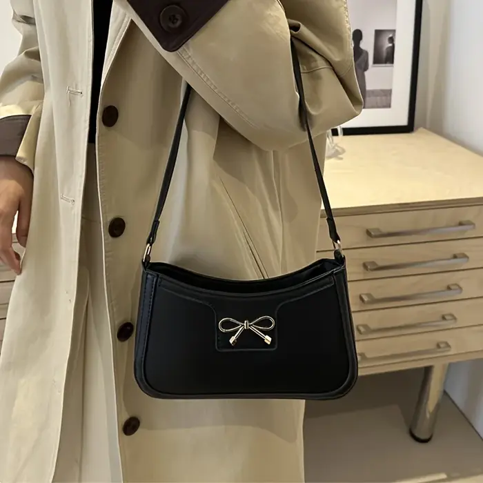 Sac à bandoulière à nœud papillon de couleur unie