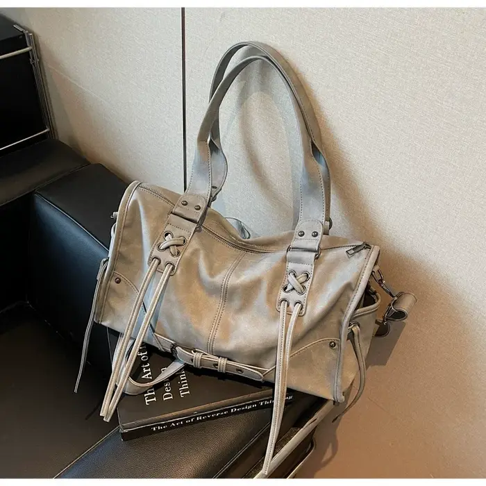 Sac à main rétro pour femme, style moto, avec pompon, sac à bandoulière haut de gamme, sac à coussin