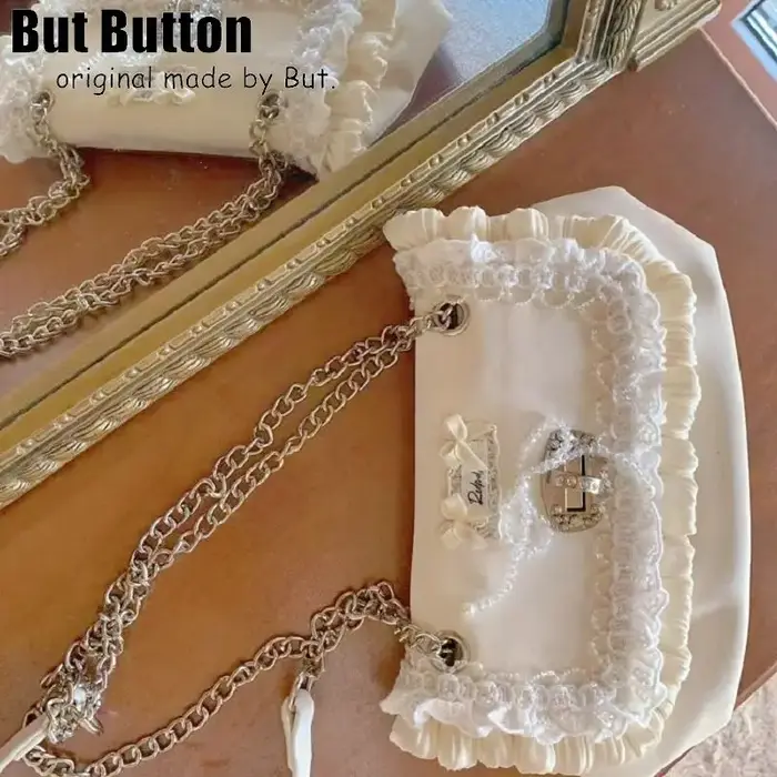 Lolita – sac à main élégant avec nœud en dentelle satinée