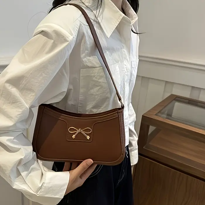 Sac à bandoulière à nœud papillon de couleur unie