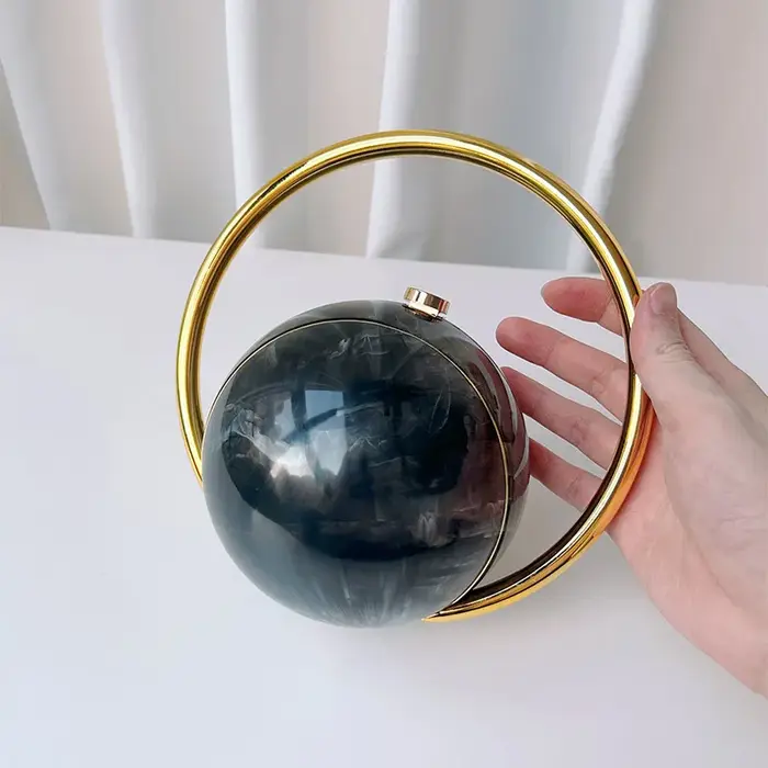 Pochette de soirée de luxe de styliste avec poignée en boule