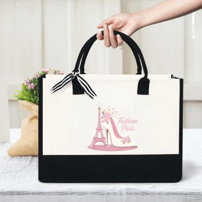 Sac à main élégant en talons tour Eiffel crème et noir au design floral avec un texte parisien éléga