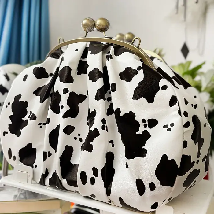LOST IN VINTAGE – pochette en tissu à motif de vache