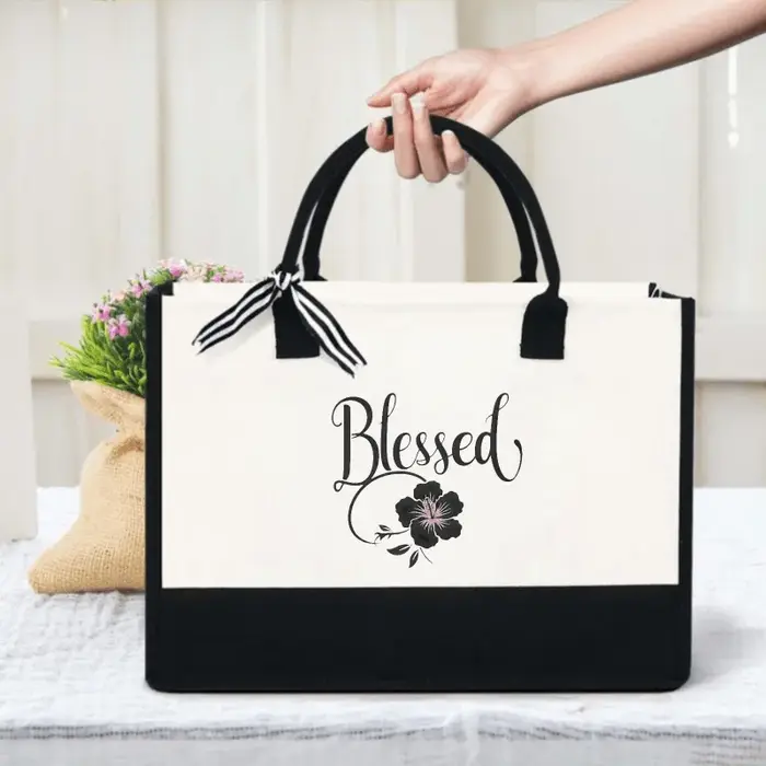 Sac fourre-tout en toile au design floral blanc et noir pour un usage quotidien, un shopping et un t