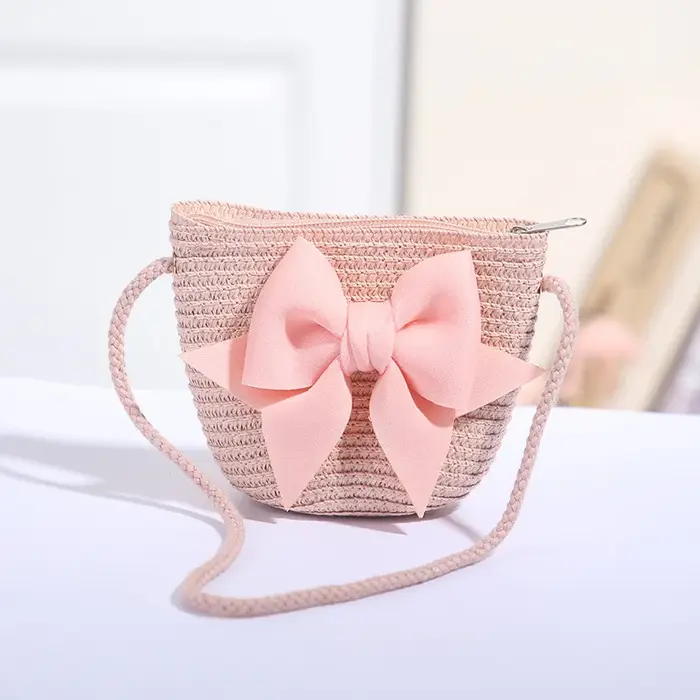 Sac à bandoulière rose avec nœud papillon pour fille