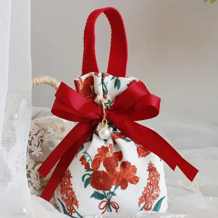 Mini sac à cordon en toile à motif floral avec nœud papillon et chaîne de perles, pochette à bijoux,