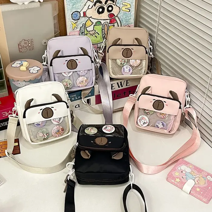 Sacs à bandoulière avec badge Capybara pour femme