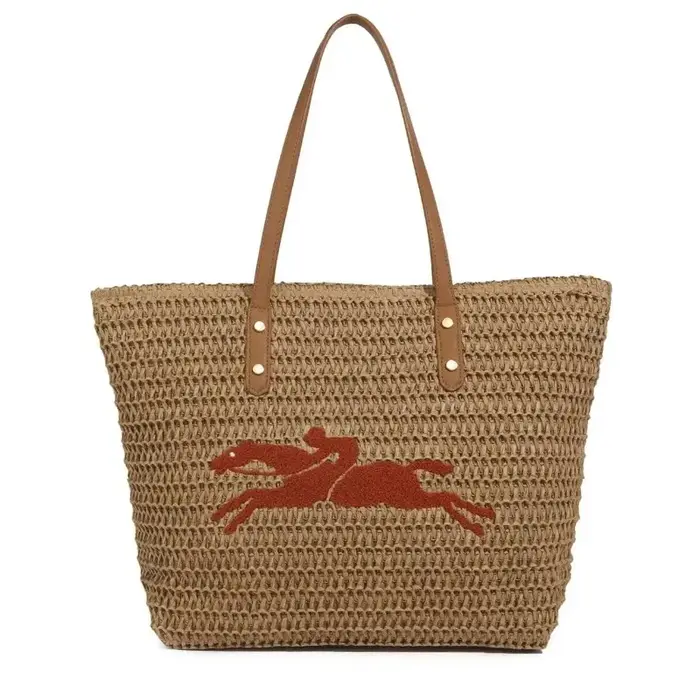 Sac à langer minimaliste de luxe : élégant sac à main bandoulière pour femme avec une touche de design vintage et un grand compartiment.