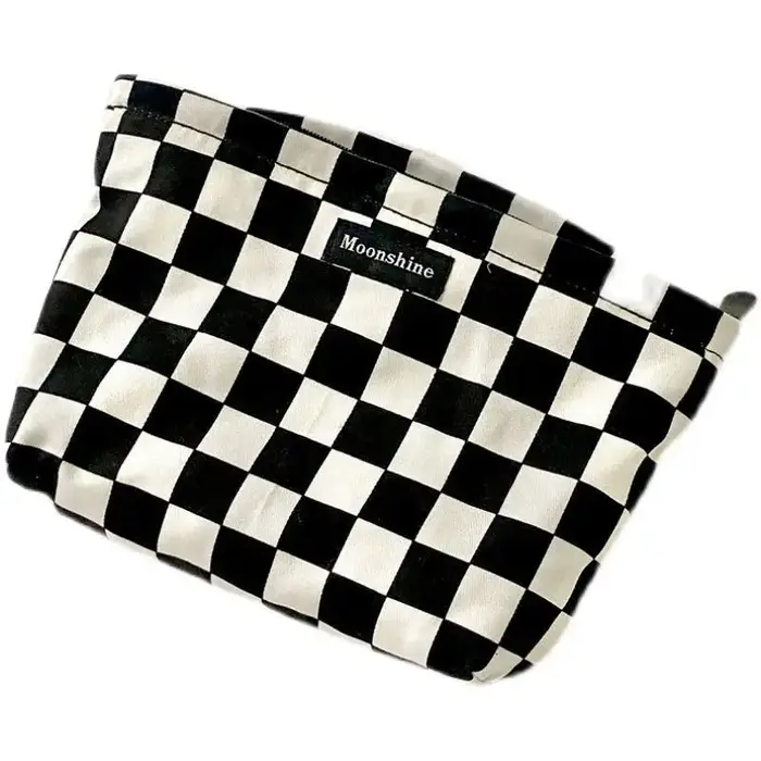 Sac à cosmétiques à carreaux noir et blanc