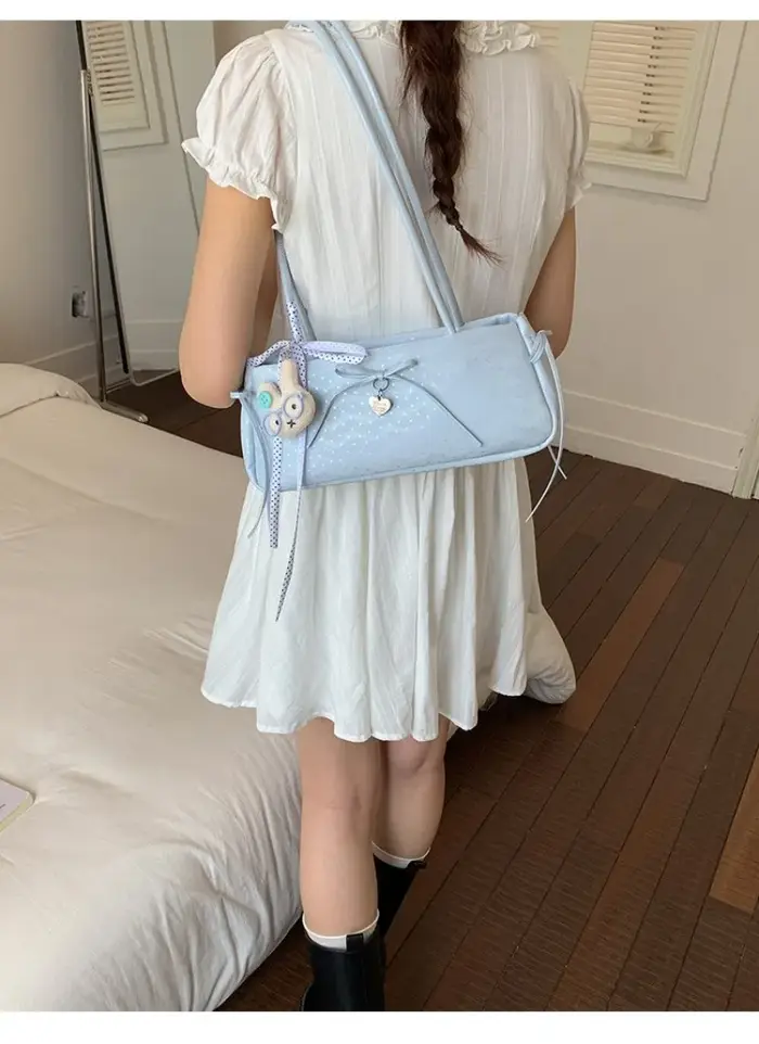 Sac à bandoulière long pour femme avec nœud à pois et breloque cœur
