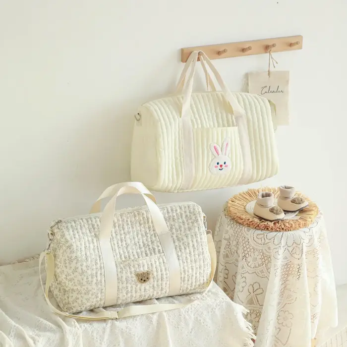Sacs à couches sacs à couches pour maman sac fourre-tout de grande capacité sac de créateur de luxe sac à couches d'activité de messager florale mère et bébé