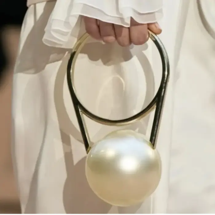 Pochette de soirée de luxe de styliste avec poignée en boule