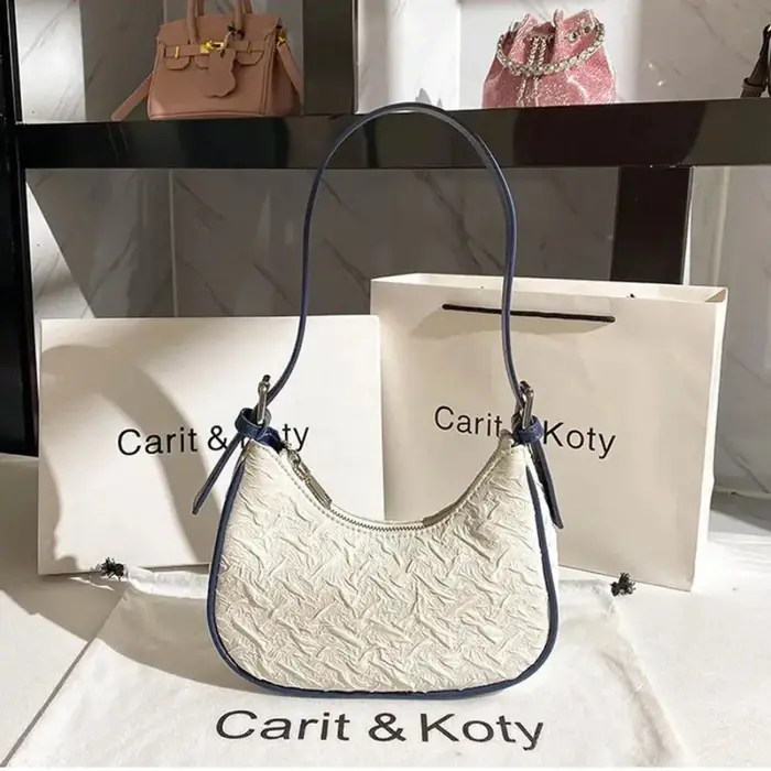Sac plissé tendance de l'année, design original et raffiné, sac croissant pour femme, design de niche estival, sac porté épaule