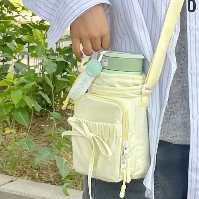 Sac à bandoulière pour bouteille d'eau à nœud papillon