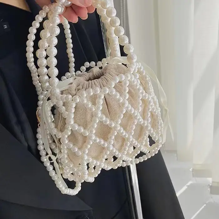 Sac à main rétro français fée populaire tissé perlé sac seau sac à bandoulière été Niche Design évidé