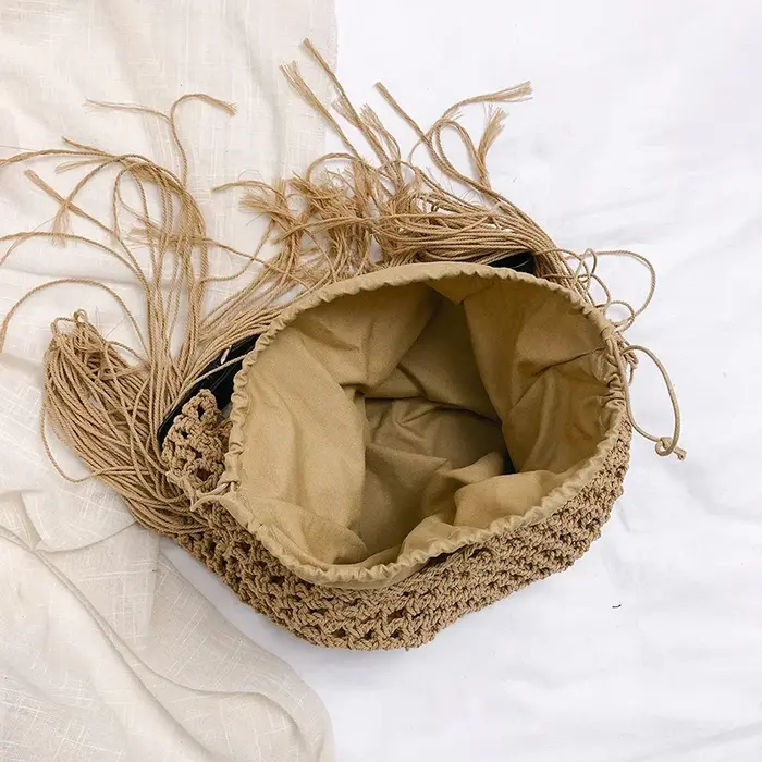 2025 nouveau sac de plage en paille de créateur pour les femmes mode gland sac à main fourre-tout sac de vacances décontracté dame Crochet évider sac à bandoulière