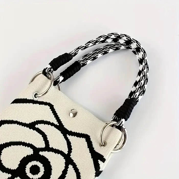 Sac à main tricoté à motif de fleurs noir et blanc