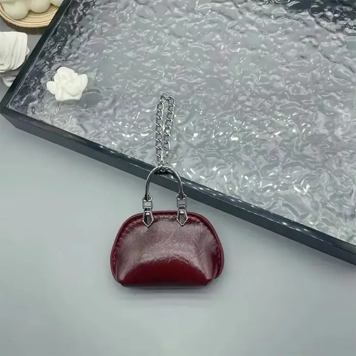 Nouveau Sac décoration sac pendentif petit cuir PU Mini sac à main couleur unie sac suspendu