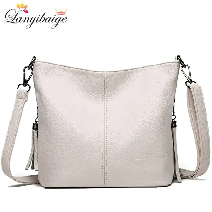 Sac à main en cuir avec pompon pour femme