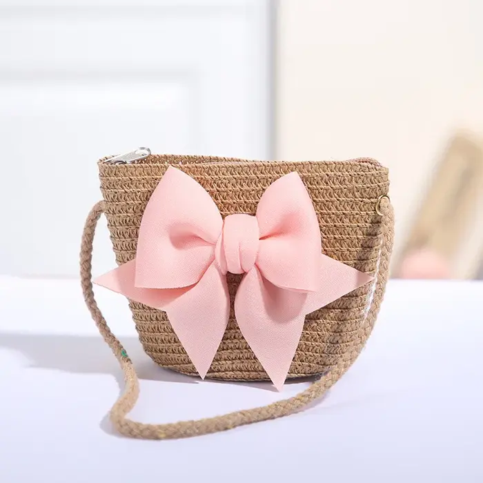 Sac à bandoulière rose avec nœud papillon pour fille