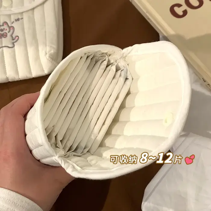 Sac de rangement portable mignon pour serviettes hygiéniques et tampons