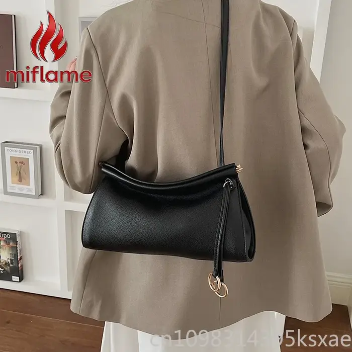 Sac à bandoulière en cuir vintage avec silhouette structurée