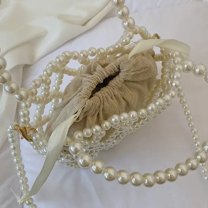Sac à main rétro français fée populaire tissé perlé sac seau sac à bandoulière été Niche Design évidé