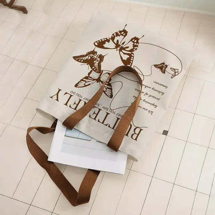 Sac fourre-tout vintage marron avec imprimé papillon et citation