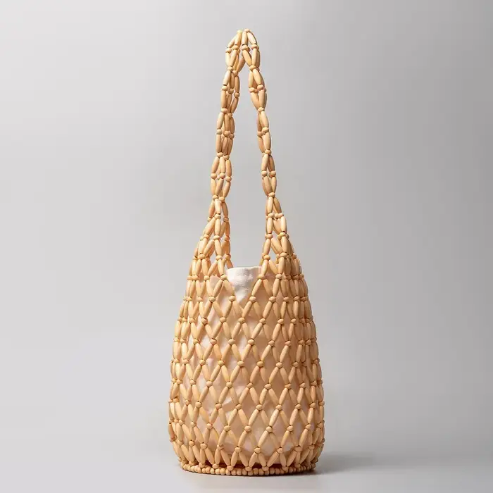 Sac tissé Design exquis évider perle de bois fourre-tout seau sac à bandoulière femme été plage sac 