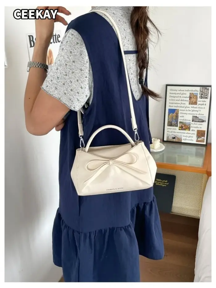 Sac à main mini trapèze élégant en PU souple avec grand nœud décoratif