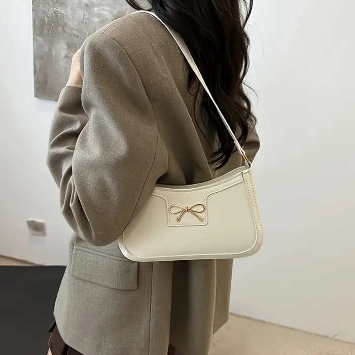 Sac à bandoulière à nœud papillon de couleur unie