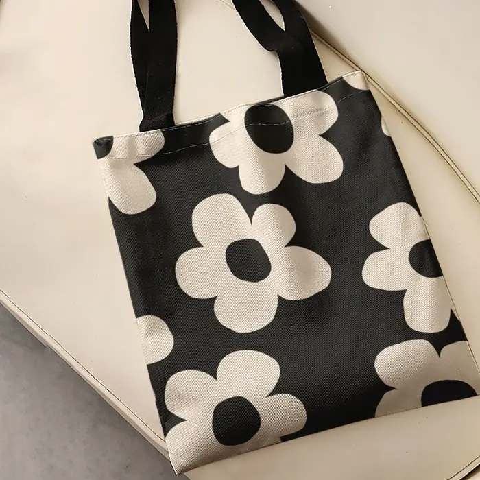 Sac fourre-tout à imprimé floral simple beige sur fond noir
