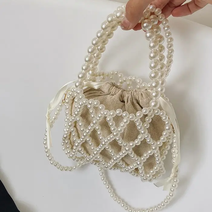 Sac à main rétro français fée populaire tissé perlé sac seau sac à bandoulière été Niche Design évidé