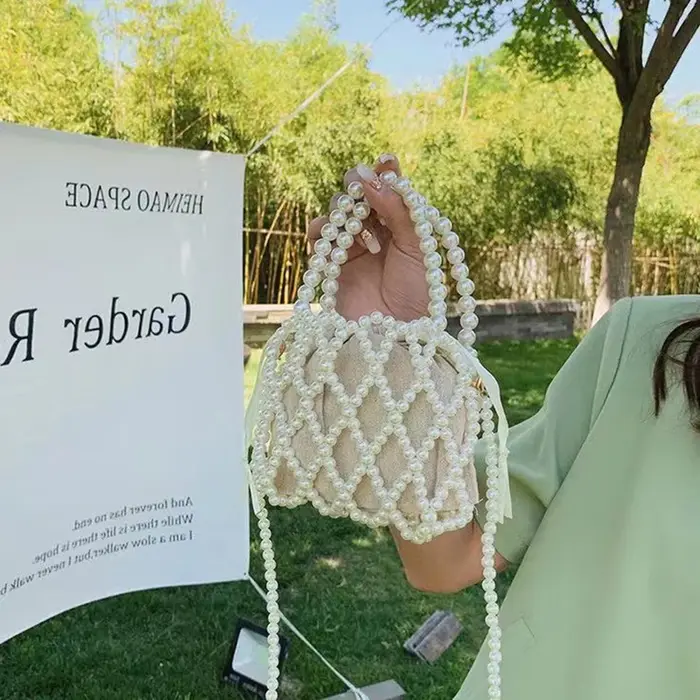 Sac à main rétro français fée populaire tissé perlé sac seau sac à bandoulière été Niche Design évidé