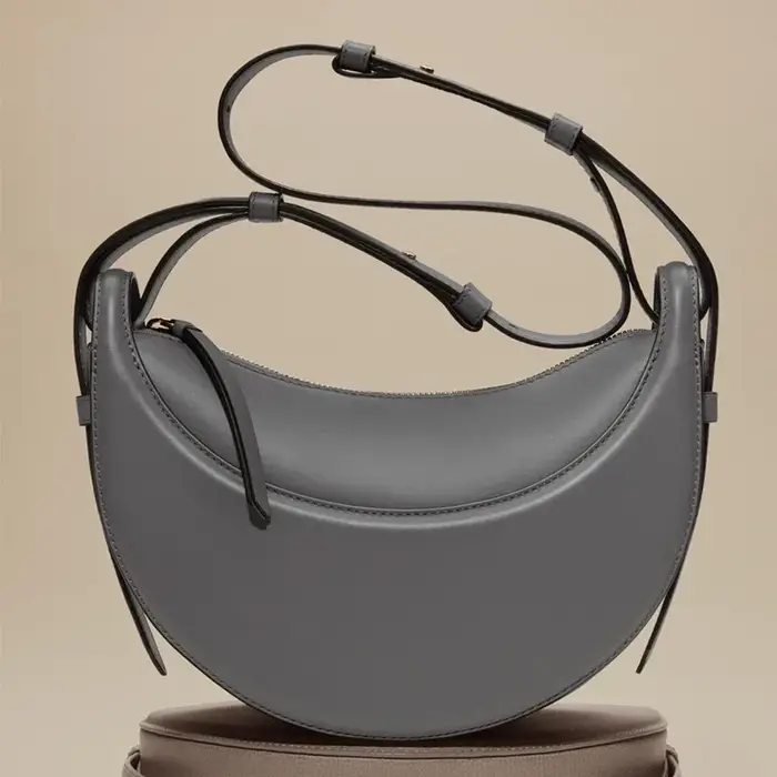 Sac à bandoulière en cuir véritable pour femme, modèle croissant, design de niche, fermeture éclair,
