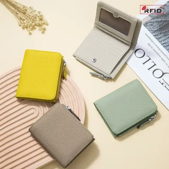 Poudres d'écouteurs en cuir véritable pour hommes et femmes, portefeuilles courts RFID, porte-cartes, sac portable en cuir de vachette, petite fermeture éclair, porte-monnaie