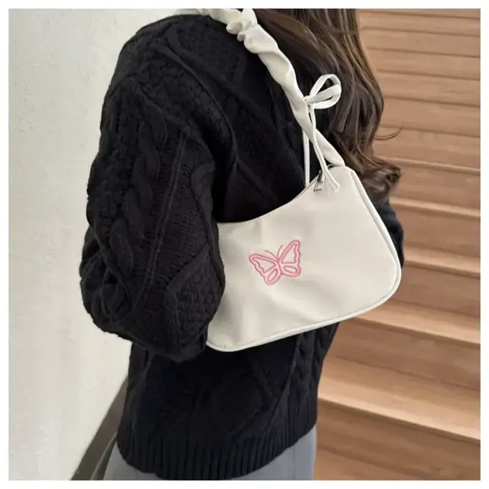 Sac à bandoulière brodé avec nœud papillon